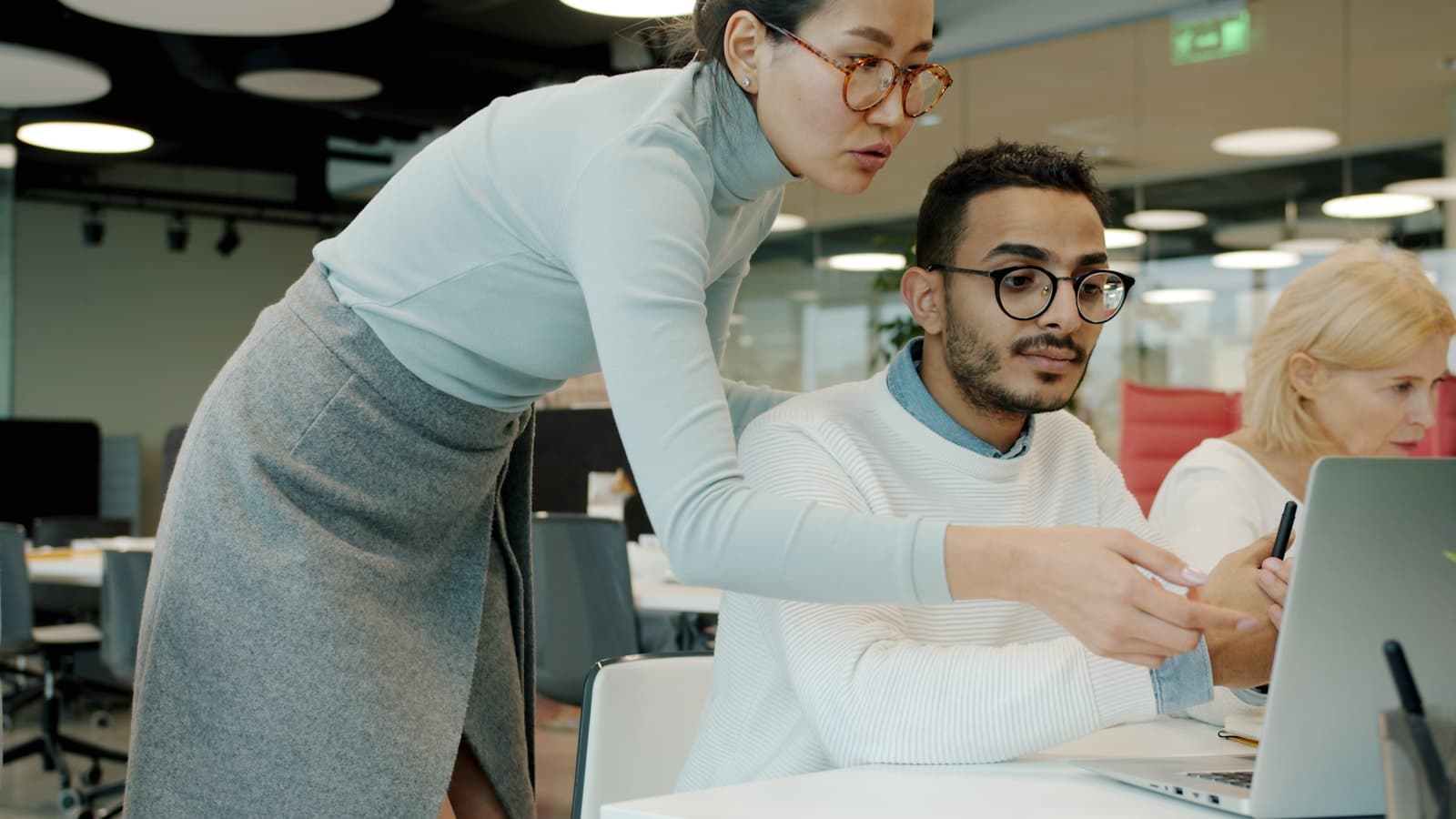 A team reviewing work together in an office